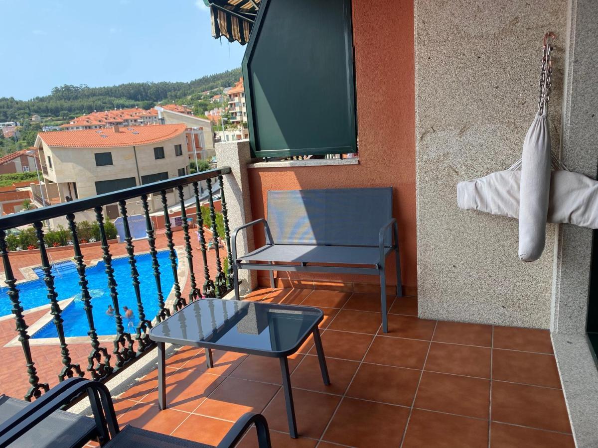 Apartamento Apartamento con vistas al mar, piscina y parking Sanxenxo Exterior foto